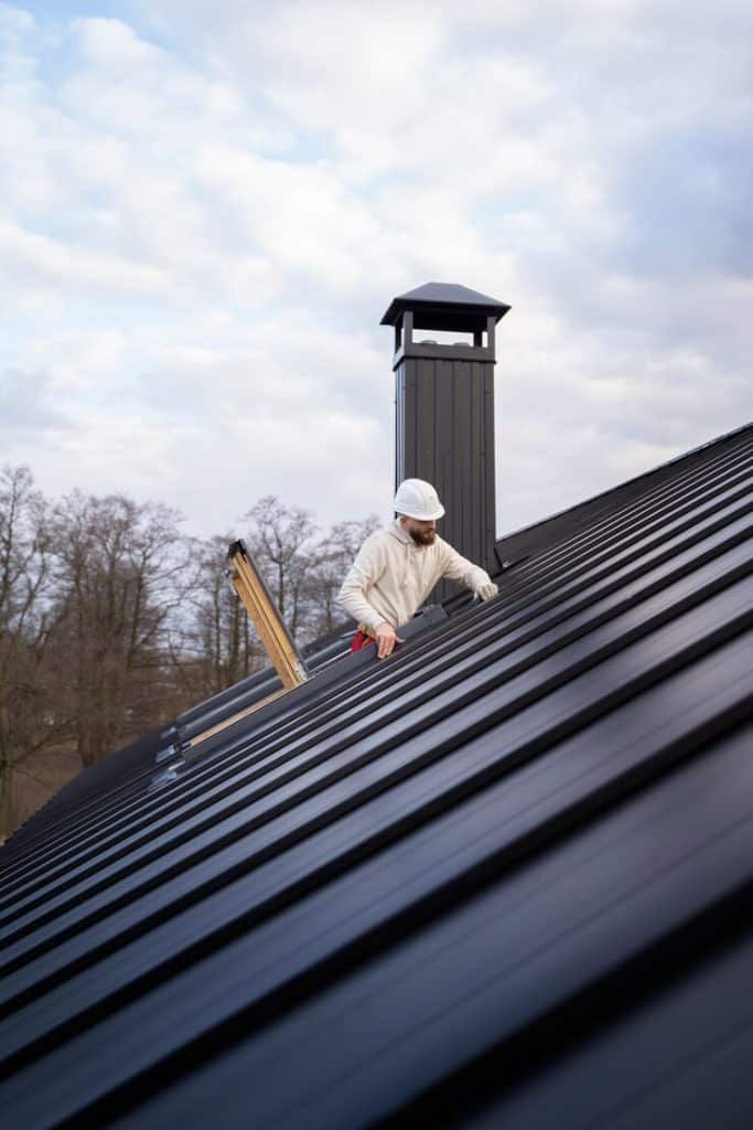 man working on roof